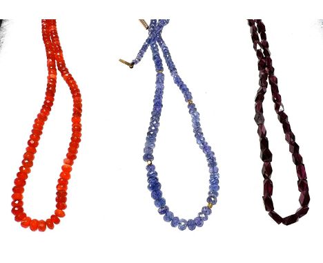 FIRE OPAL - a string of faceted beads, 42cm; TANZANITE - a string of faceted beads, 45cm (9ct clasp);  GARNET - a string of f