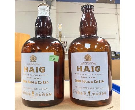 JOHN HAIG WHISKEY -&nbsp; a pair of one gallon display bottles, printed enamel labels, 38cm. 