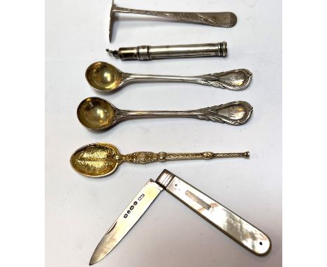 A selection of hallmarked silver including a pair of salt spoons; a silver gilt anointing spoon; a child's push; a propelling