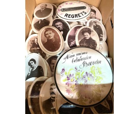 A collection of photographs on ceramic plaques 
