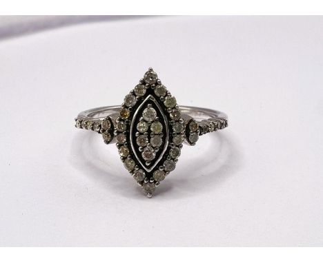 A silver dress ring with approx. 34 small diamonds in marquise shape setting and on shoulders, size P/Q, 2.9gms 