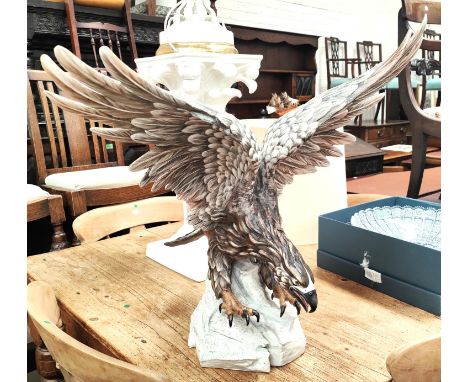 An Italian ceramic eagle in coloured bisque porcelain, height 61cm, wings 62cm 