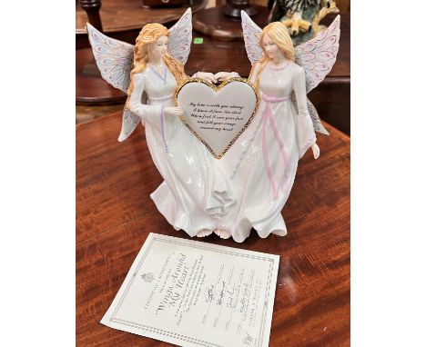 A Royal Worcester figure with musical feature 'Wings around my Heart' 