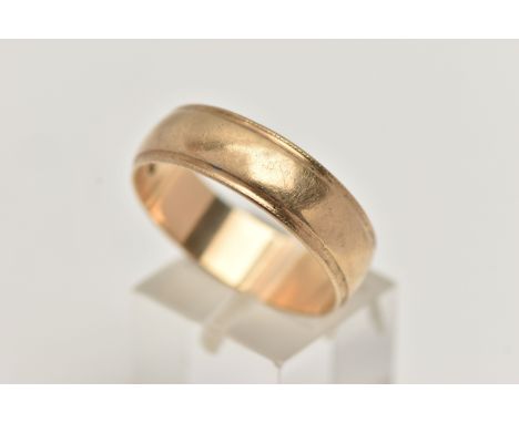 A 9CT GOLD BAND RING, a wide band with a stepped edge milgrain detail, approximate width 7mm, hallmarked 9ct London, ring siz