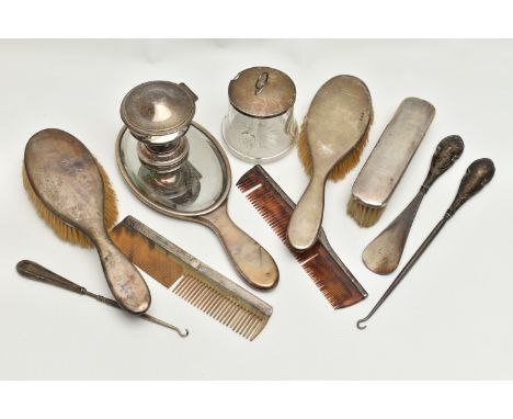 A SELECTION OF SILVER VANITY ITEMS, to include a four piece, polished silver dressing table set, comprising of two hair brush