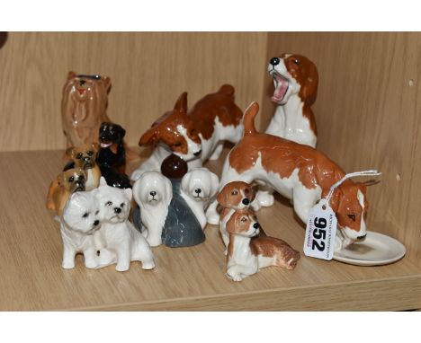 A COLLECTION OF NINE BESWICK DOG FIGURES INCLUDING THREE PLAYFUL PUPPIES,  comprising Yorkshire Terrier laughing, model no. 2