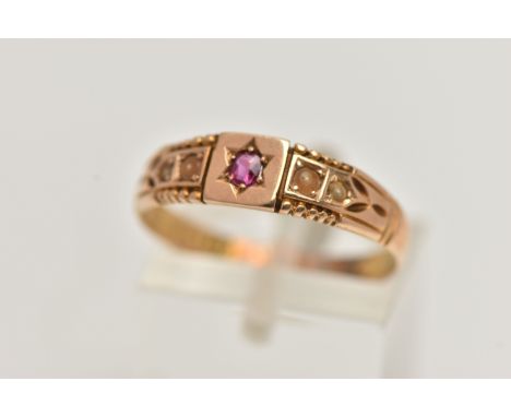 A LATE VICTORIAN 15CT GOLD RING, designed with a star set circular cut ruby, flanked with discoloured split pearls and detail