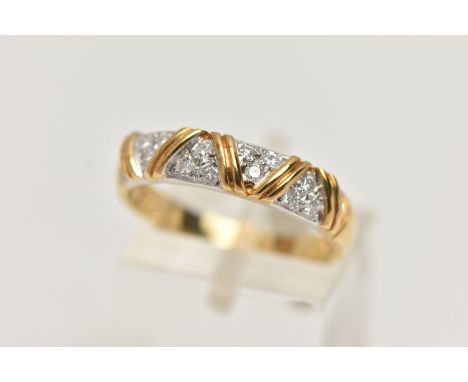 AN 18CT GOLD DIAMOND HALF ETERNITY BAND RING, set with small round brilliant cut diamonds, in a white gold mount with yellow 