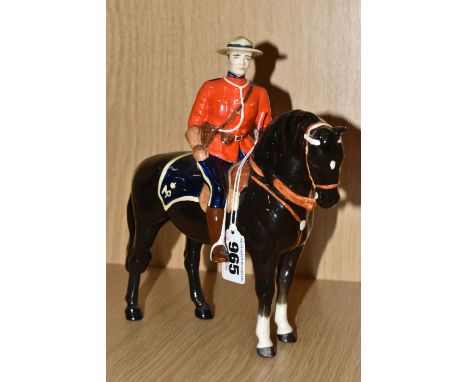 A BESWICK CANADIAN MOUNTIE, MODEL NO. 1375 (Condition report: professional restoration to the Mountie's hat, otherwise appear