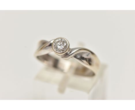 AN 18CT GOLD SINGLE STONE DIAMOND RING, a round brilliant cut diamond, bezel set in white gold, approximate total diamond wei