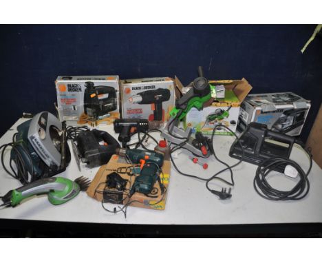 SEVEN POWER TOOLS comprising of a Black and Decker Wallpaper Strimmer, Jigsaw, Heat gun, Heat gun and Circular saw, a Florabe
