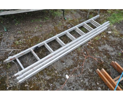 AN ALUMINIUM TRIPLE EXTENTION LADDER, labelled Lyte Int to side, each section length 220cm