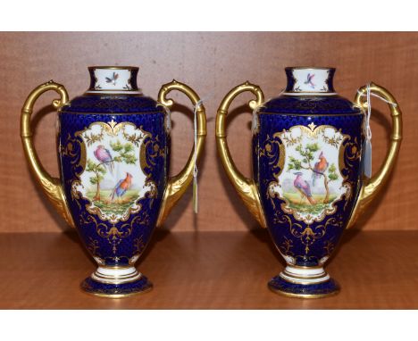 A PAIR OF EARLY 20TH CENTURY COALPORT TWIN HANDLED VASES, the fish scale blue ground with printed and raised foliate gilding 