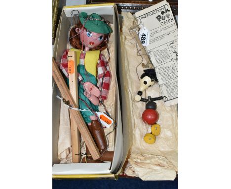 A BOXED PELHAM PUPPET COWGIRL, AND A SMALL MICKEY MOUSE STRING PUPPET, both of painted wood construction, Cowgirl includes bo