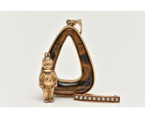 A PENDANT, BROOCH AND A CHARM, the pendant of an open work triangular form, set with tigers eye, fitted with a polished taper