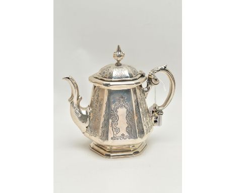 A MID VICTORIAN SILVER TEAPOT, engraved floral and foliate pattern, fitted with an ivory insulated scroll handle with leaf th