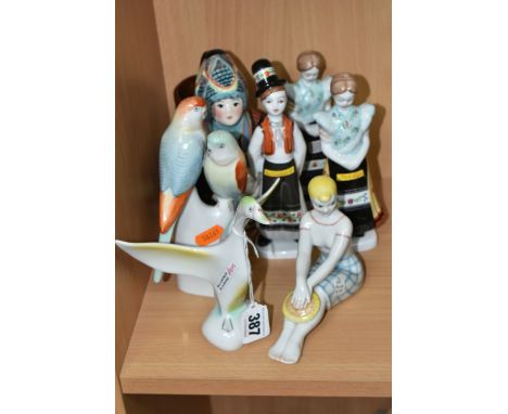 A GROUP OF EASTERN EUROPEAN CERAMIC FIGURES, comprising a Hollohaza swan, a Hollohaza figure group of two parakeets, a Ukrain