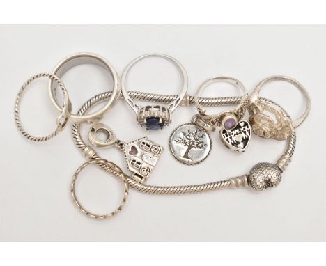 AN ASSORTMENT OF JEWELLERY, to include a signed 'Pandora' bracelet, two 'Pandora' charms and a wide band ring, approximate gr