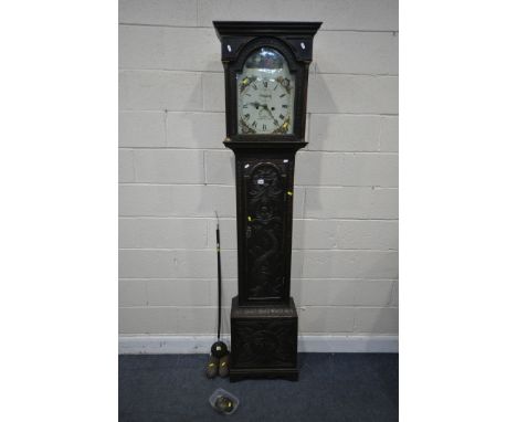 A GEORGIAN CARVED OAK 8 DAY LONGCASE CLOCK, the box hood with a domed glass door enclosing a painted 10 inch dial, bell strik