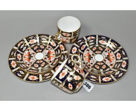 TWO ROYAL CROWN DERBY IMARI 2451 TRIOS, comprising two teacups, two saucers, and two 18cm tea plates, with red printed backst