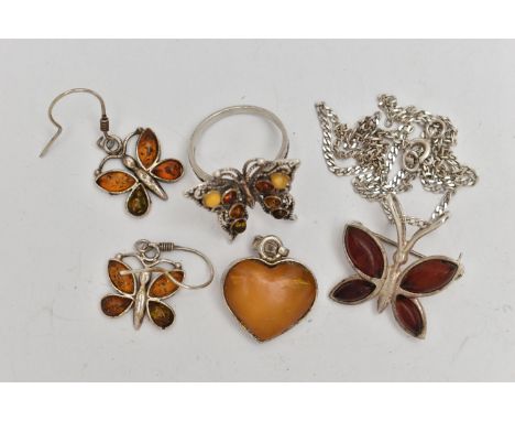AN ASSORTMENT OF WHITE METAL JEWELLERY, to include an amber pendant, a pair of copal amber earrings, a copal amber ring and p