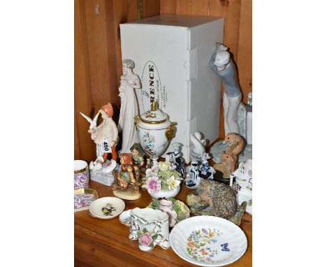 A GROUP OF CERAMIC ORNAMENTS, comprising a Llado 4824  'Golfer' figure (missing golf club), a boxed Florence 'Giuseppe Armani