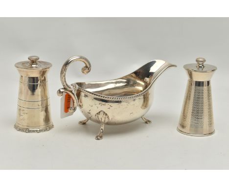 AN ELIZABETH II SILVER SAUCE BOAT AND TWO ELIZABETH II SILVER MILK CHURN SHAPED PEPPERMILLS, the sauce boat with gadrooned ri