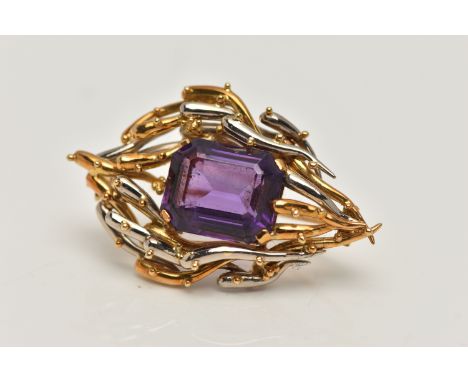 AN 18CT BI-COLOUR AMETHYST BROOCH, centring on a rectangular cut amethyst with cut off corners, four claw set in a yellow and