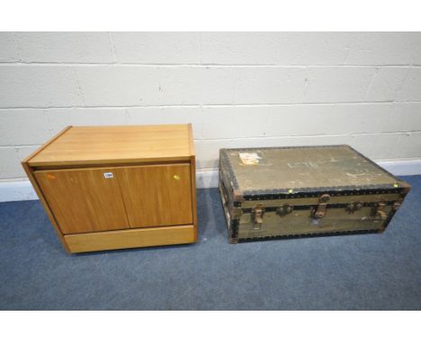 A MID CENTURY TEAK TWO DOOR RECORD CABINET, along with a vintage travelling trunk (condition:-distressed finish to trunk) (2)