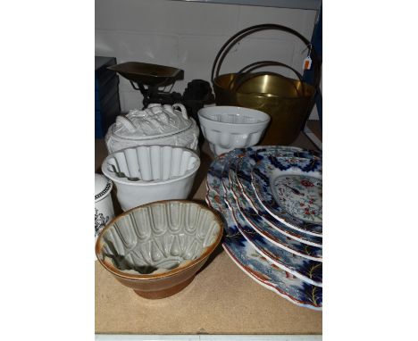 A SET OF FIVE GRADUATED LATE 19TH CENTURY IRONSTONE PLATES, decorated with an exotic bird and floral borders, kite mark impre