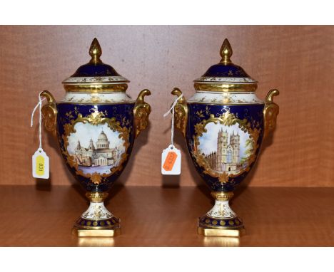 TWO COALPORT TWIN HANDLED VASES AND COVERS, blue, gilt and pale yellow ground, one with a hand painted vignette of Westminste