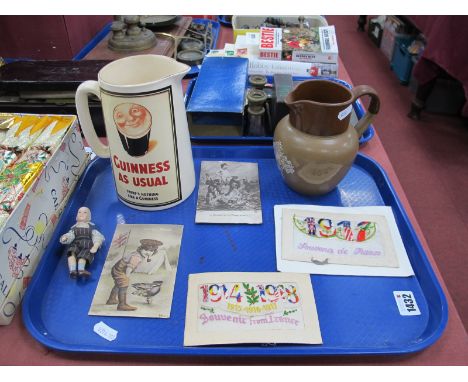 Vintage Cadbury Jug, later Guinness example, pottery doll 10cm high, two WWI embroidered postcards, two urinating on German m