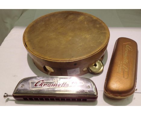 Vintage tambourine and a cased Hohner Chrometta 12 harmonica. P&amp;P Group 2 (£18+VAT for the first lot and £3+VAT for subse