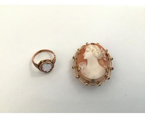 A 9ct gold mounted shell cameo brooch, 20thc., oval with female profile bust, together with an unmarked yellow metal ring set