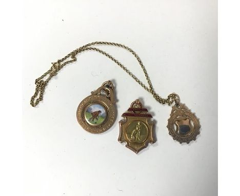 A collection of 9ct gold medals from the Cumberland Bowling Association, including 1904 won by W.Leece, one on a belcher yell