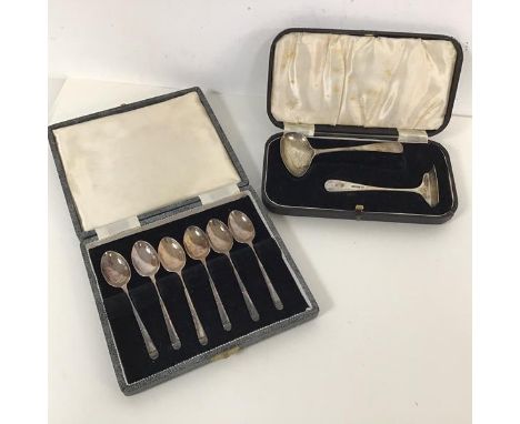 A boxed set of six Sheffield silver teaspoons, a presentation baby spoon and table scrape (combined: 75.40g)