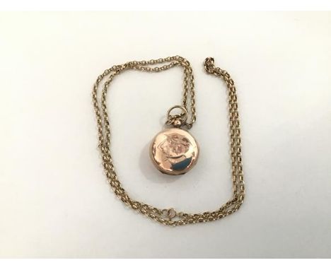 A Birmingham silver 9ct gold sovereign case, of characteristic design, engraved with a monogram, on a curblink chain stamped 