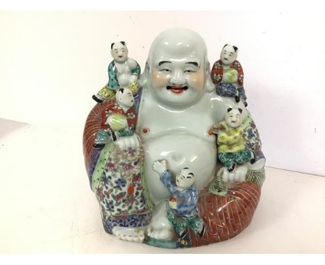 A modern ceramic seated Buddha, with five children (24cm x 27cm x 15cm)