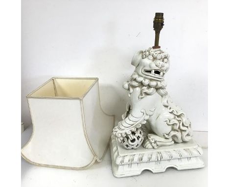 A large Chinese white Dog of Fou table lamp complete with shade (52cm to top of lamp holder x 32cm x 20cm)`