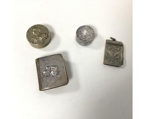 A travel size Book of Common Prayer with an Edwardian silver cover with cherubs (1.5cm x 5.5cm x 4.5cm) an Art Nouveau notebo