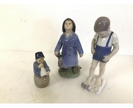 A Danish B &amp; J figure of a Boy in Tidal Pool (repairs) (20cm) and two other Royal Copenhagen figures (3)