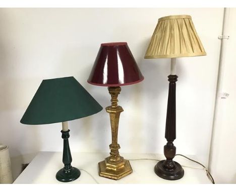 A mixed lot of lamps including a green painted wooden lamp, a baluster shaped gilt lamp with hexagonal base (62cm to top of s