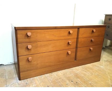 A Stag teak low chest of drawers with rounded edges, fitted three long drawers and three short drawers, on plinth base (63cm 