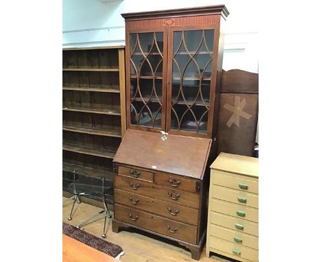 An Edwardian mahogany bureau bookcase the interior fitted with central inlaid compartment with shell and marquetry edge, with