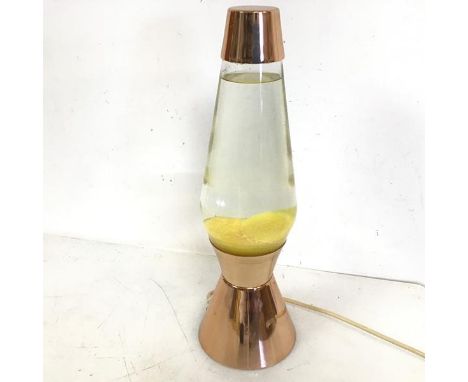 A 1960s/70s lava lamp, with copper top and conical base, with yellow lava (43cm x 13cm to base)