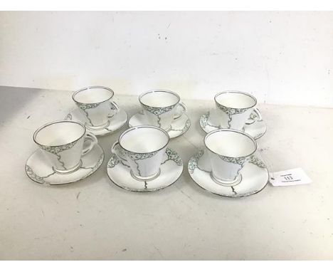 A set of six Flosmaron teacups, of conical form, complete with matching saucers, all with tree decoration (teaucps: 6cm x 9cm