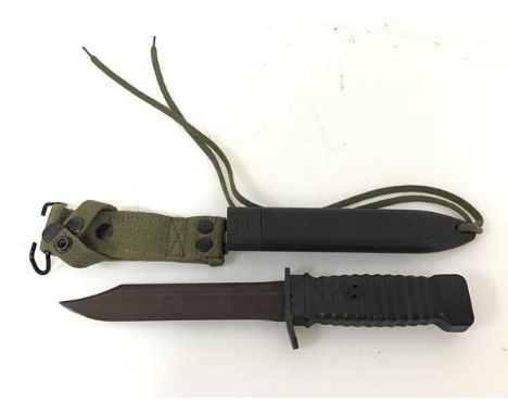A Vietnam period jungle knife with US style hard plastic ribbed handle and scabbard (model 78B), with canvas frog (34cm)