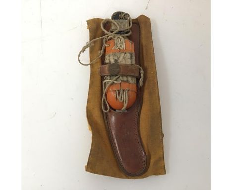 A WWII period US Navy/Airforce lift raft rescue knife (leather scabbard, signed in pencil 2/LT Tomlinson) (21cm x 9cm)