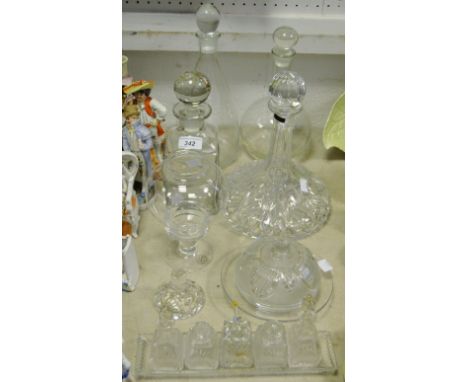 A Thomas Webb cut glass ships decanter; a globe & shaft decanter; another whiskey; a Dartington Crystal tea light; condiment 