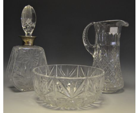 A cut glass decanter with silver collar; a lead crystal jug and bowl. (3)